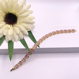 Yellow gold finish pink tourmaline round cut twisted created diamond bracelet