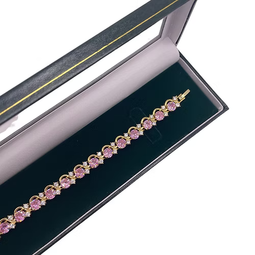 Yellow gold finish pink tourmaline round cut twisted created diamond bracelet